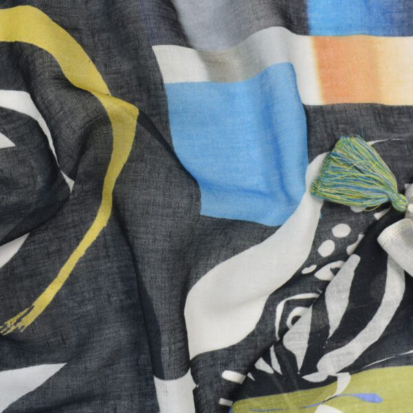 Abstract print scarf with tassels.