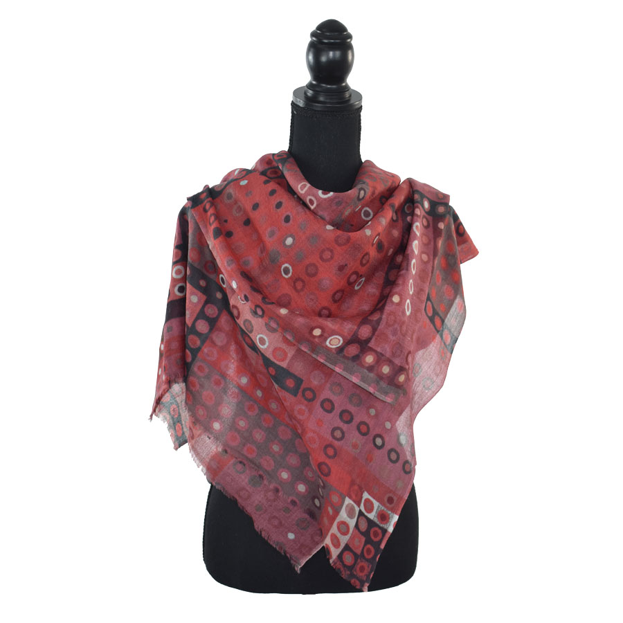 Red and black patterned wool shawl.
