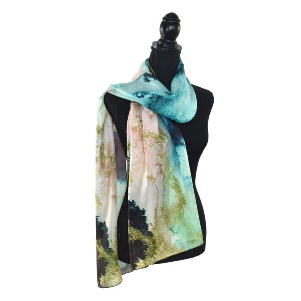 Abstract teal silk scarf on mannequin.