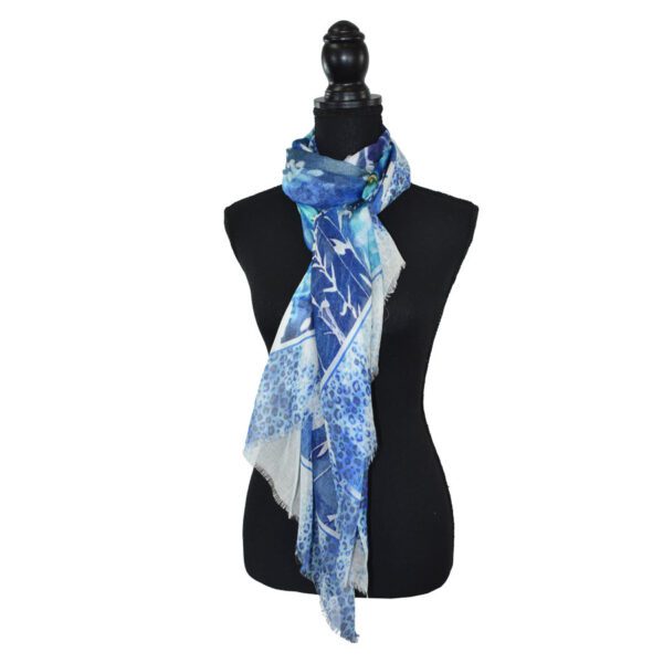 Blue and white patterned scarf on mannequin.