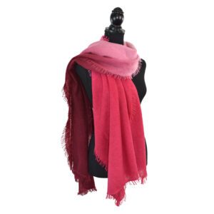 Elegant pink scarf displayed on a black mannequin.