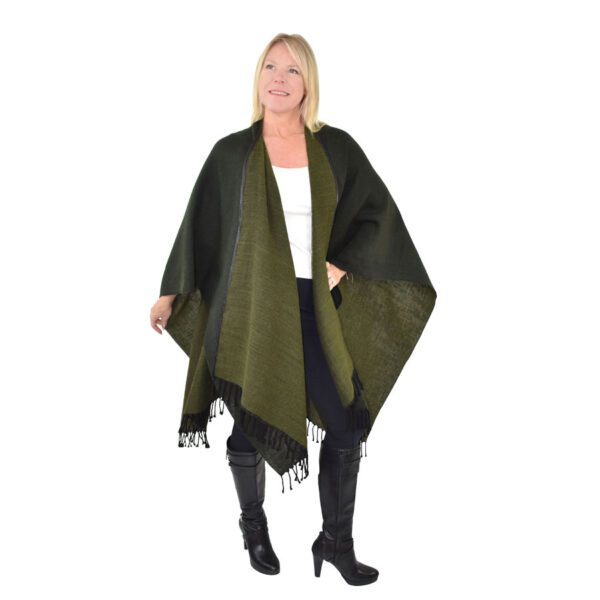 Woman in olive green fringed poncho.