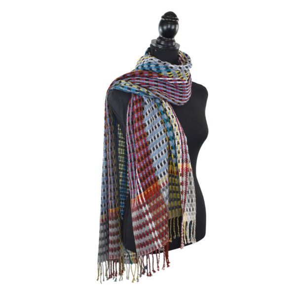 Colorful plaid shawl on mannequin.