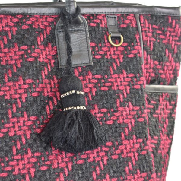 Red and black tweed tote bag with tassel.