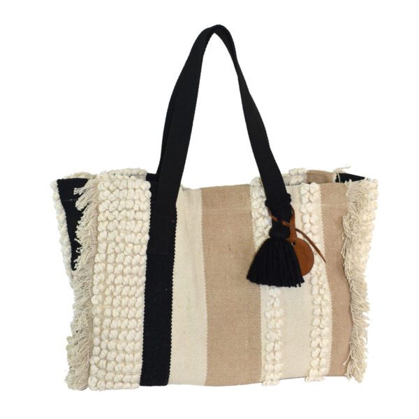 A black and white bag with tassels on the handle.