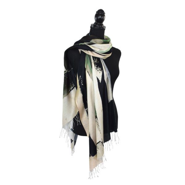 Elegant black and beige shawl draped on a mannequin.